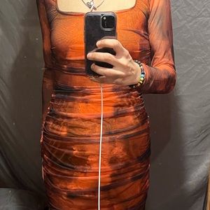 Mid thigh burnt orange and black club dress